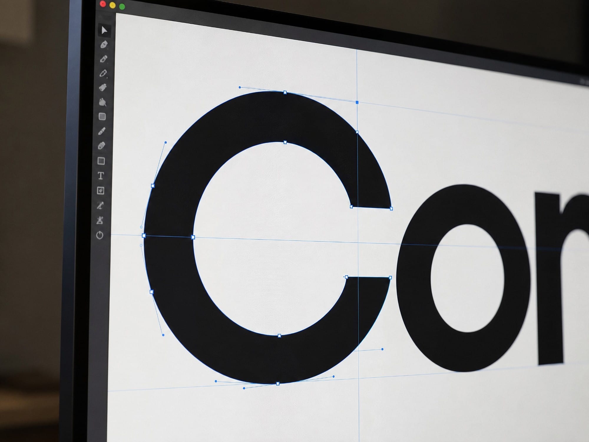 A wordmark's letter C being refined with vector points on a screen