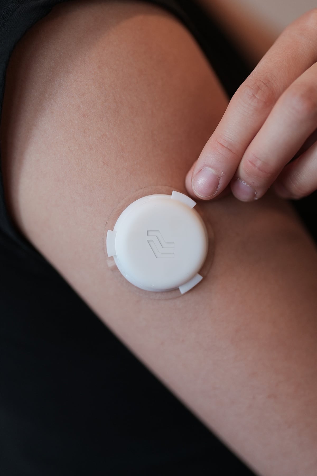 A Level Zero hormone sensor being applied to an upper arm